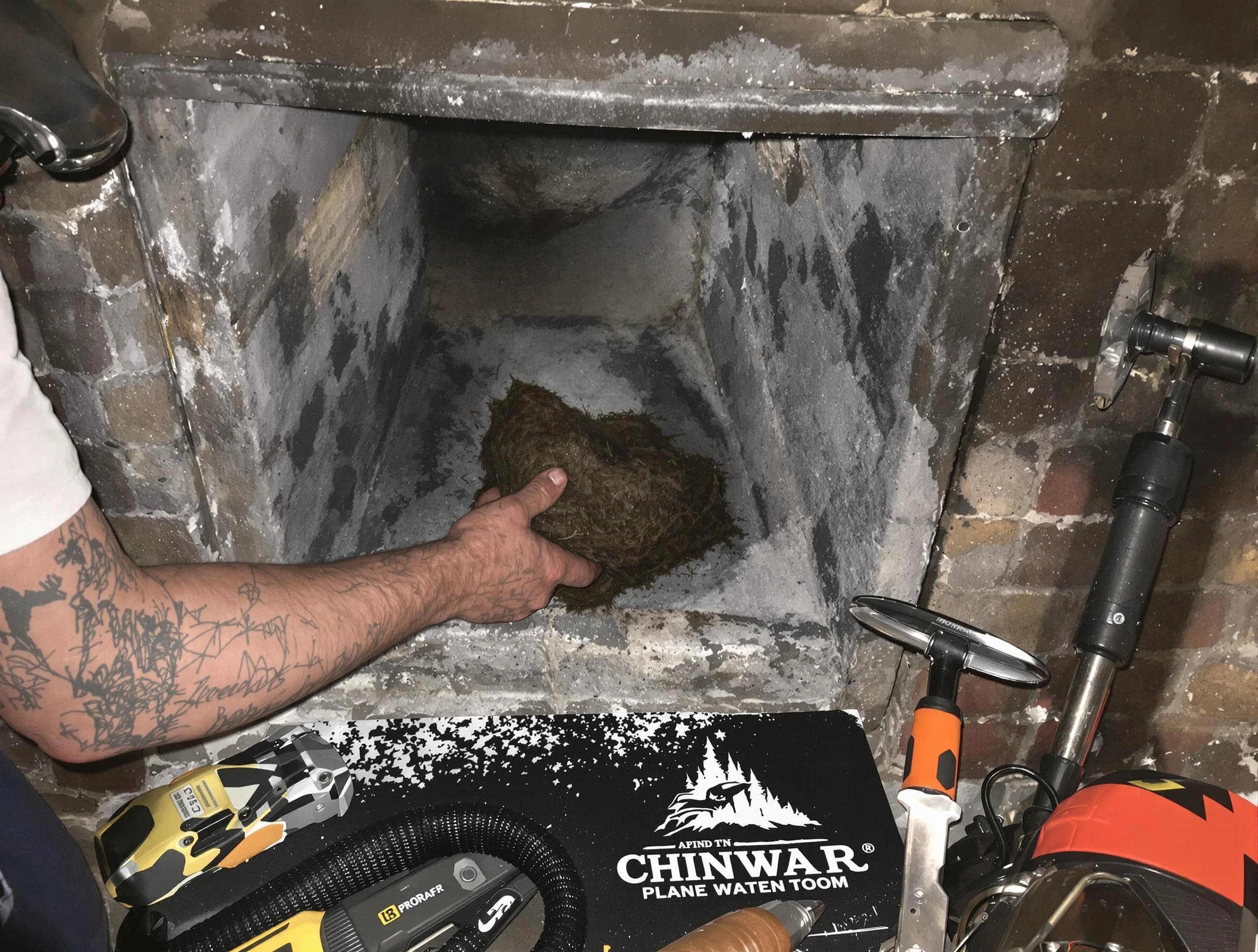 Perry Chimney Sweep safely removing debris and screening chimney in Perry, UT